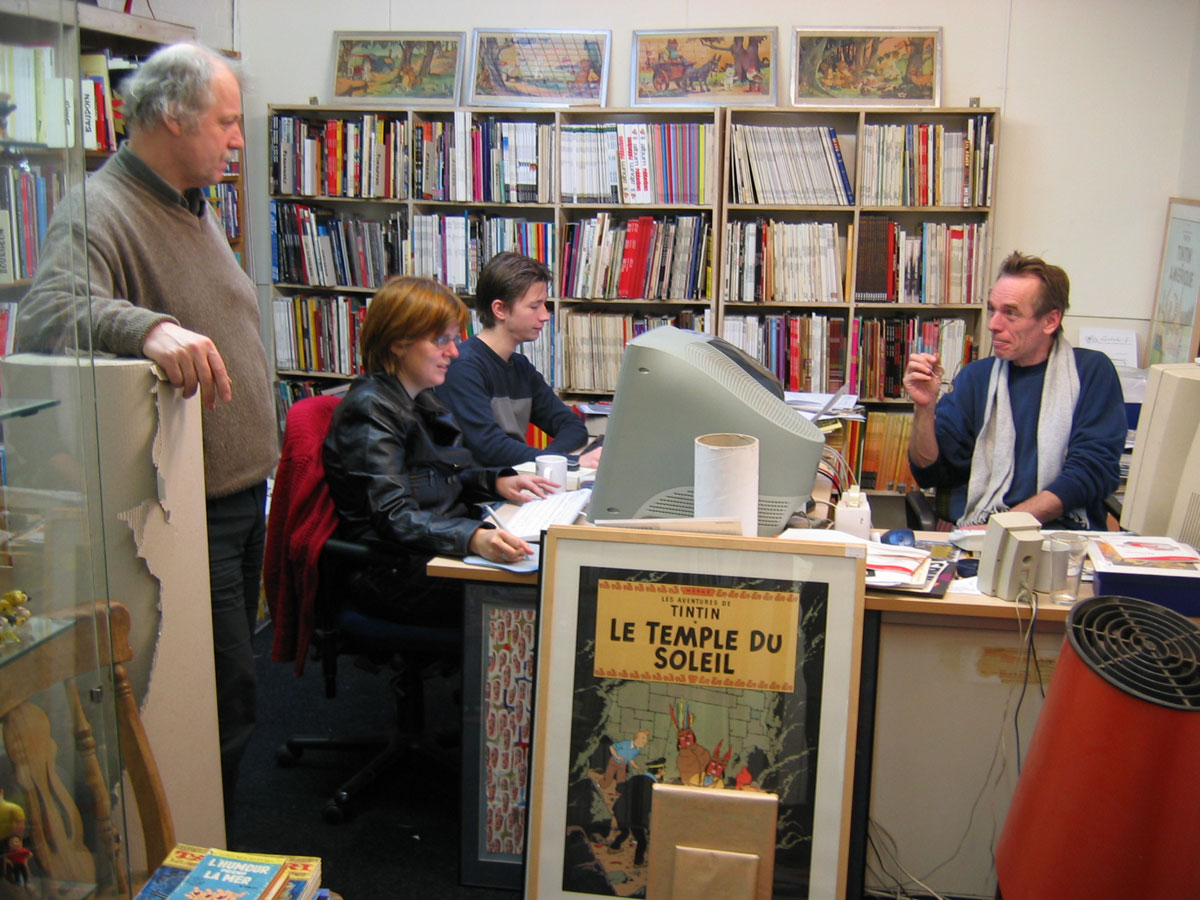 Lambiek.Net crew on a busy Friday in 2003 in the comics holodeck at Kerkstraat 119 in Amsterdam (photo by Rick Webbmaster)